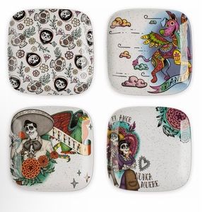 NWT. Disney set of four Coco plates. Each ceramic plate features Coco artwork